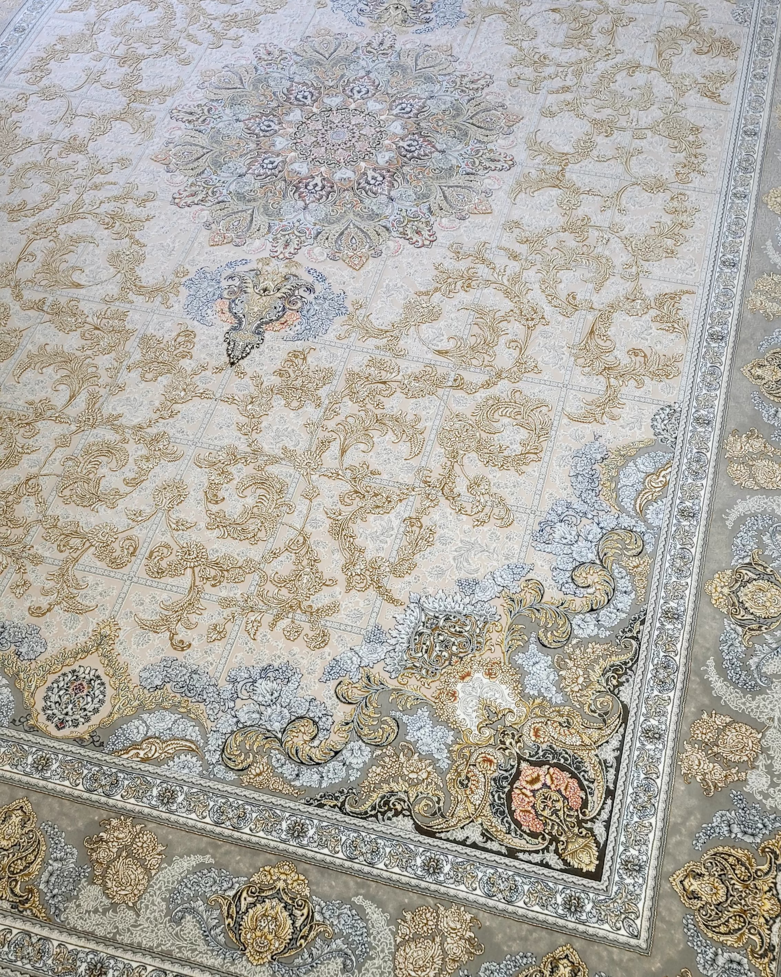 A traditional Persian style rug with beige as the primary color and intricate floral and geometric patterns.