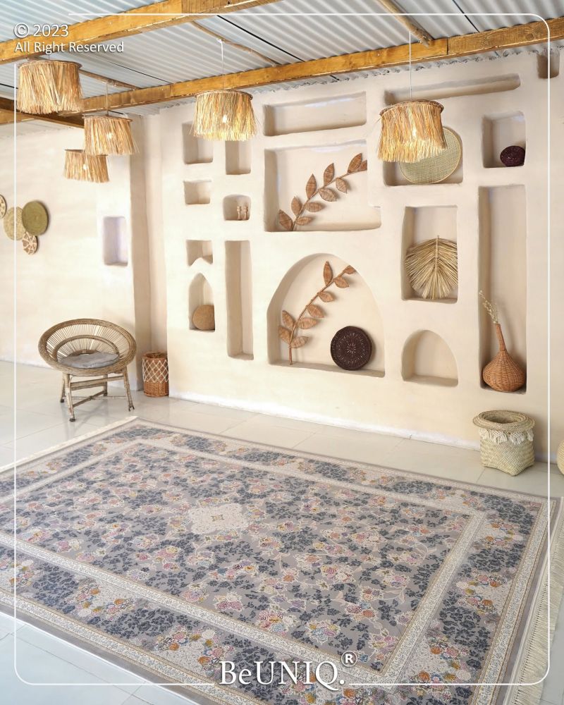 Decorative room with floral-patterned rug, wall shelves, and hanging lights.