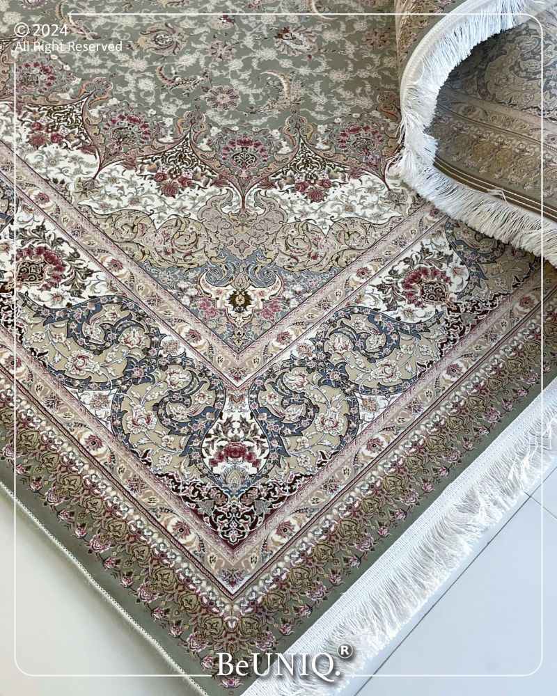Decorative rug with intricate patterns and BeUNIQ branding.