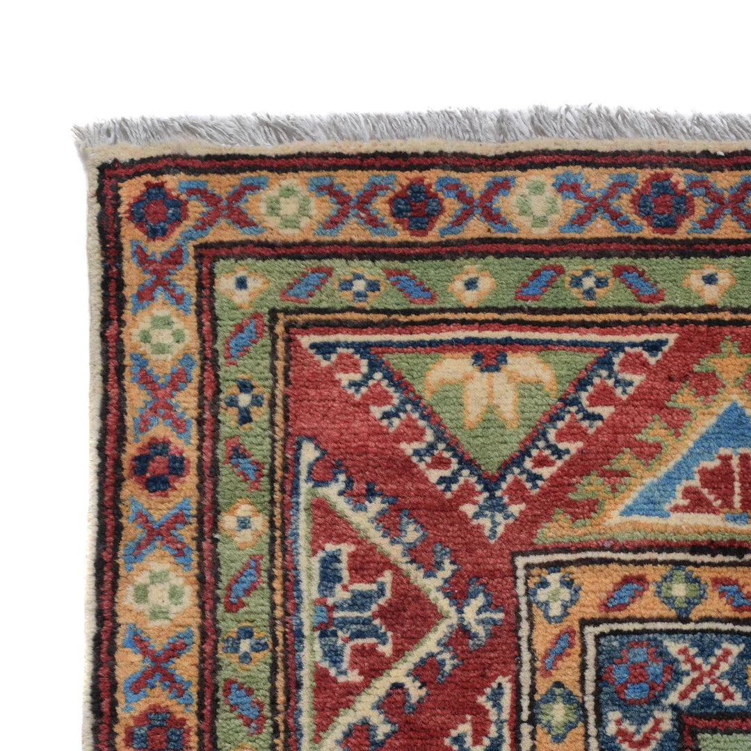 https://cdn.shopify.com/s/files/1/0943/6571/2719/files/Artisan-Kazak-Wool-Rug-Hand-Knotted-Geometric-Area-Carpet-150-217-cm-Aladdinrugs-71419874967887.webp?v=1768172499