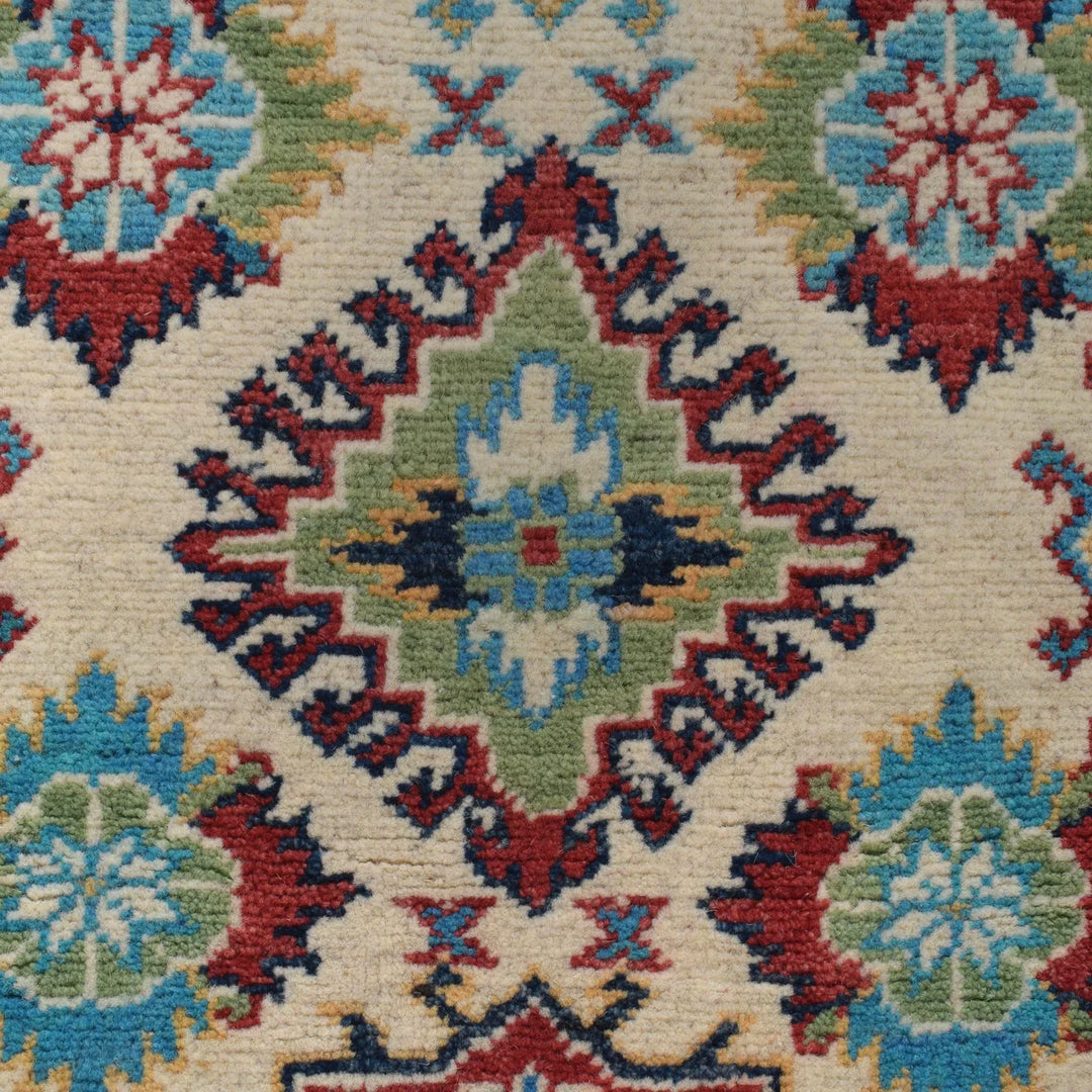 https://cdn.shopify.com/s/files/1/0943/6571/2719/files/Artisan-Kazak-Wool-Rug-Hand-Knotted-Geometric-Area-Carpet-150-217-cm-Aladdinrugs-71419875000655.webp?v=1768172499