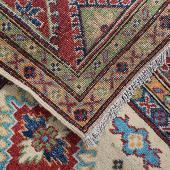https://cdn.shopify.com/s/files/1/0943/6571/2719/files/Artisan-Kazak-Wool-Rug-Hand-Knotted-Geometric-Area-Carpet-150-217-cm-Aladdinrugs-71419875033423.jpg?v=1768172499