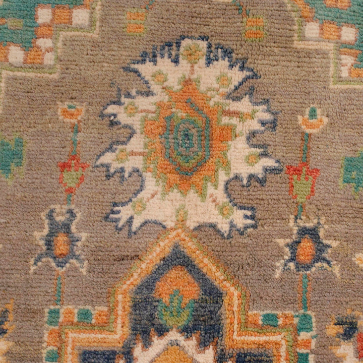 https://cdn.shopify.com/s/files/1/0943/6571/2719/files/Authentic-Kazak-Wool-Rug-Hand-Knotted-Green-Medallion-Carpet-115-178-cm-Aladdinrugs-71419657683279.jpg?v=1768185081