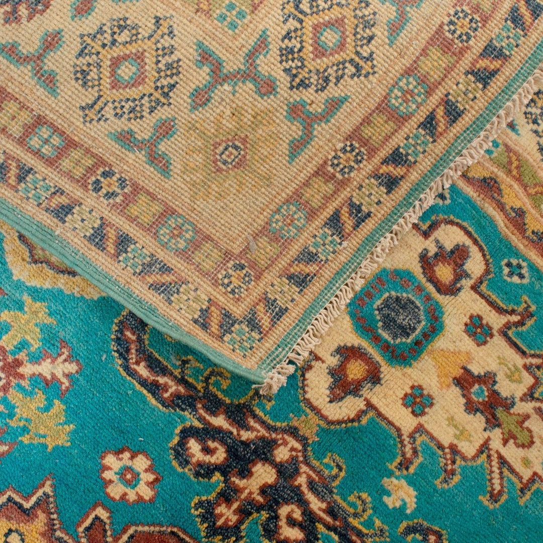 https://cdn.shopify.com/s/files/1/0943/6571/2719/files/Classic-Blue-Kazak-Rug-Hand-Knotted-Wool-Area-Carpet-123-165-cm-Aladdinrugs-71419716895055.jpg?v=1770671769
