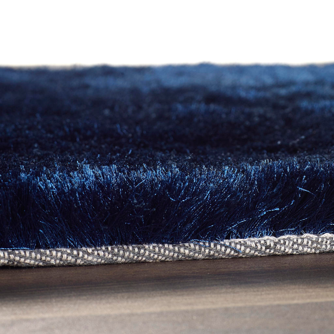 https://cdn.shopify.com/s/files/1/0881/7731/2093/files/Glamour-Shimmer-Indigo-Rug-Edge-Detail.jpg?v=1758718878