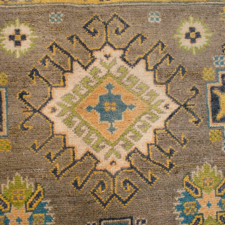 https://cdn.shopify.com/s/files/1/0943/6571/2719/files/Handmade-Brown-Kazak-Rug-Hand-Knotted-Wool-177-256-cm-Aladdinrugs-71419418968399.jpg?v=1768186995