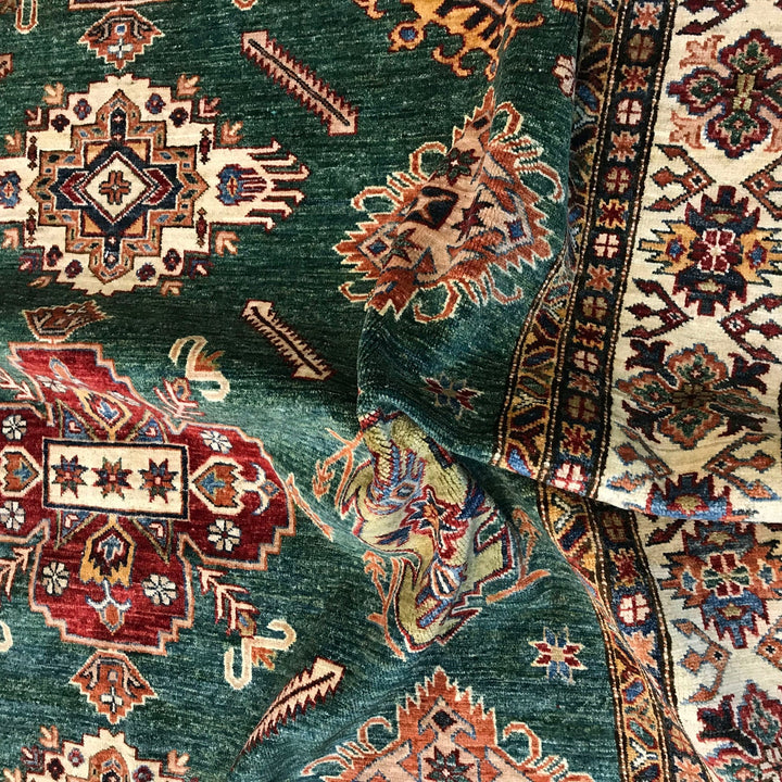https://cdn.shopify.com/s/files/1/0943/6571/2719/files/Premium-Kazak-Wool-Rug-Large-Hand-Knotted-Oriental-Medallion-210-305-cm-Aladdinrugs-71419781284175.jpg?v=1768183859
