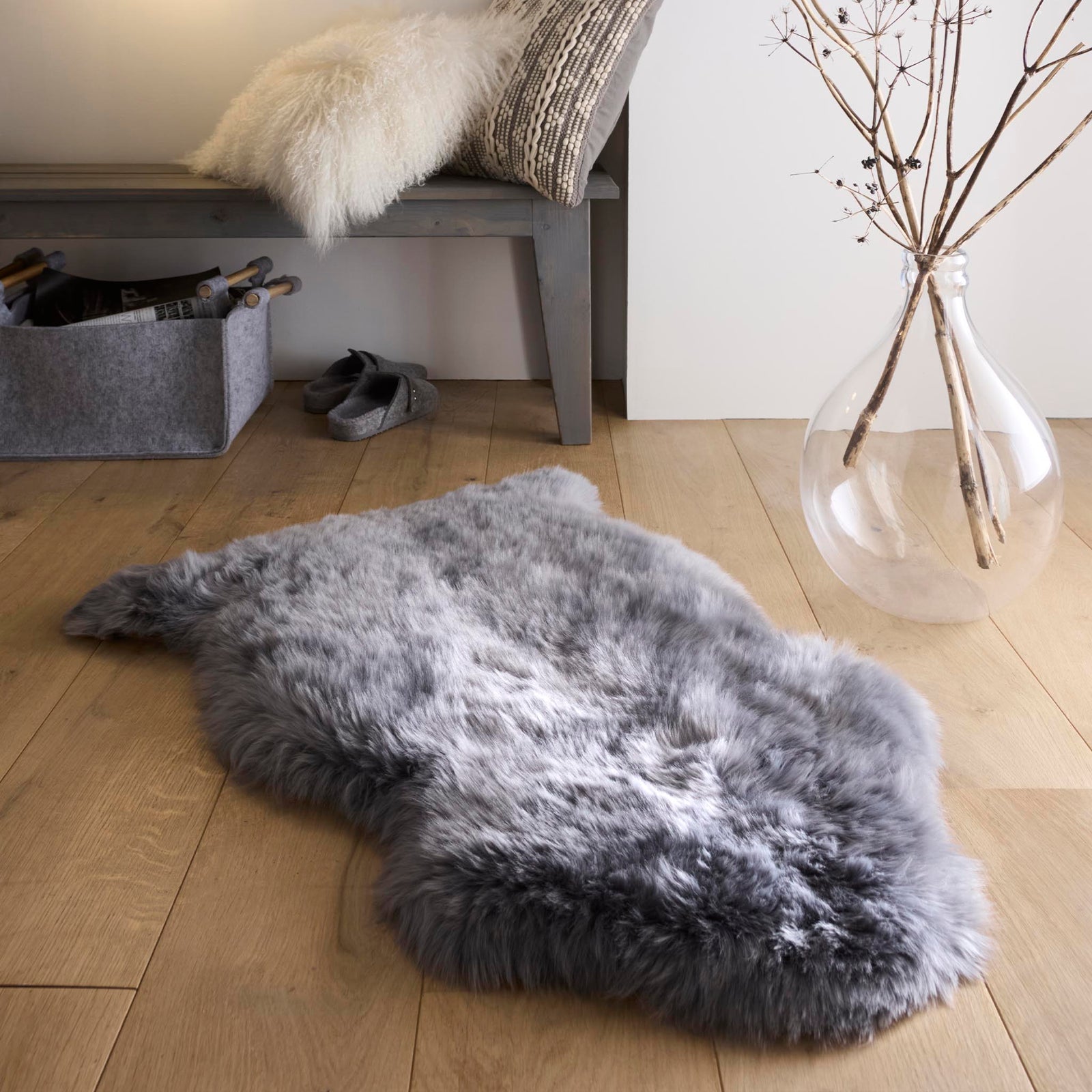 https://cdn.shopify.com/s/files/1/0881/7731/2093/files/Sheepskin-Rug-Grey-Single-Lifestyle_01.jpg?v=1761565951