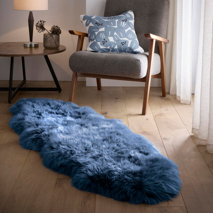 https://cdn.shopify.com/s/files/1/0881/7731/2093/files/Sheepskin-Rug-Navy-Double-Lifestyle_01.jpg?v=1762267700