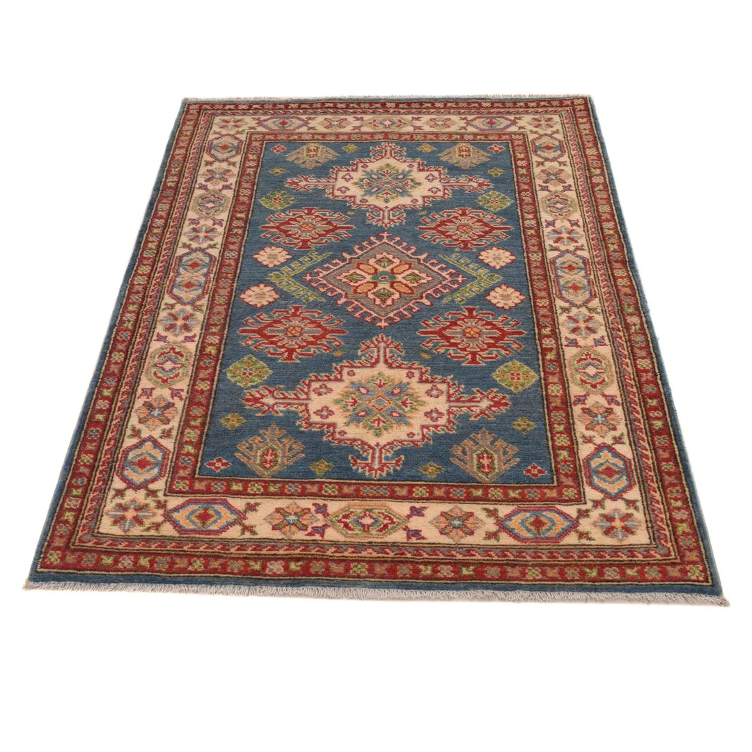 https://cdn.shopify.com/s/files/1/0943/6571/2719/files/Traditional-Kazak-Wool-Rug-Handmade-Blue-Medallion-98-153-cm-Aladdinrugs-71405080281423.webp?v=1768187190