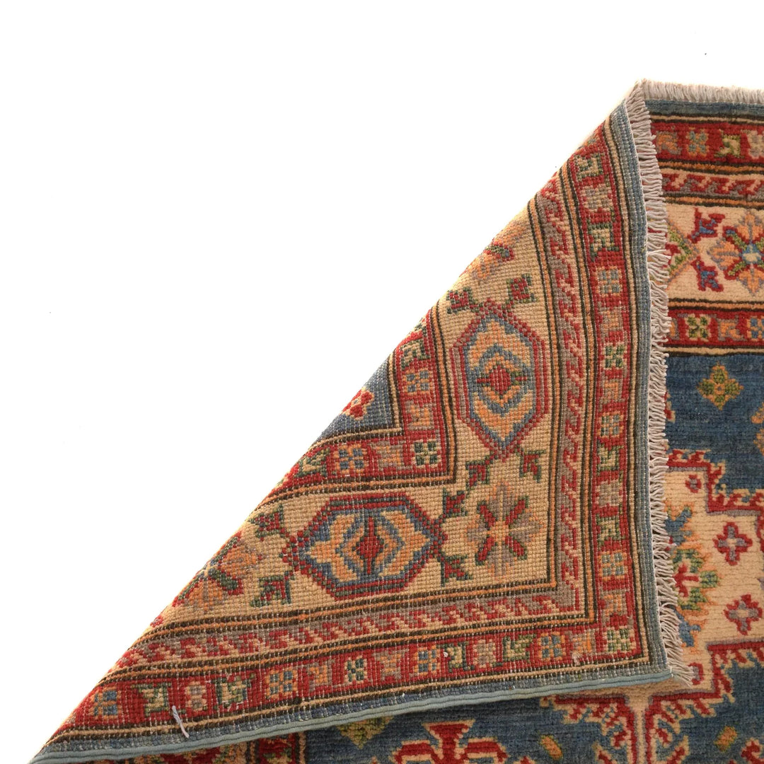 https://cdn.shopify.com/s/files/1/0943/6571/2719/files/Traditional-Kazak-Wool-Rug-Handmade-Blue-Medallion-98-153-cm-Aladdinrugs-71405080445263.webp?v=1768187190