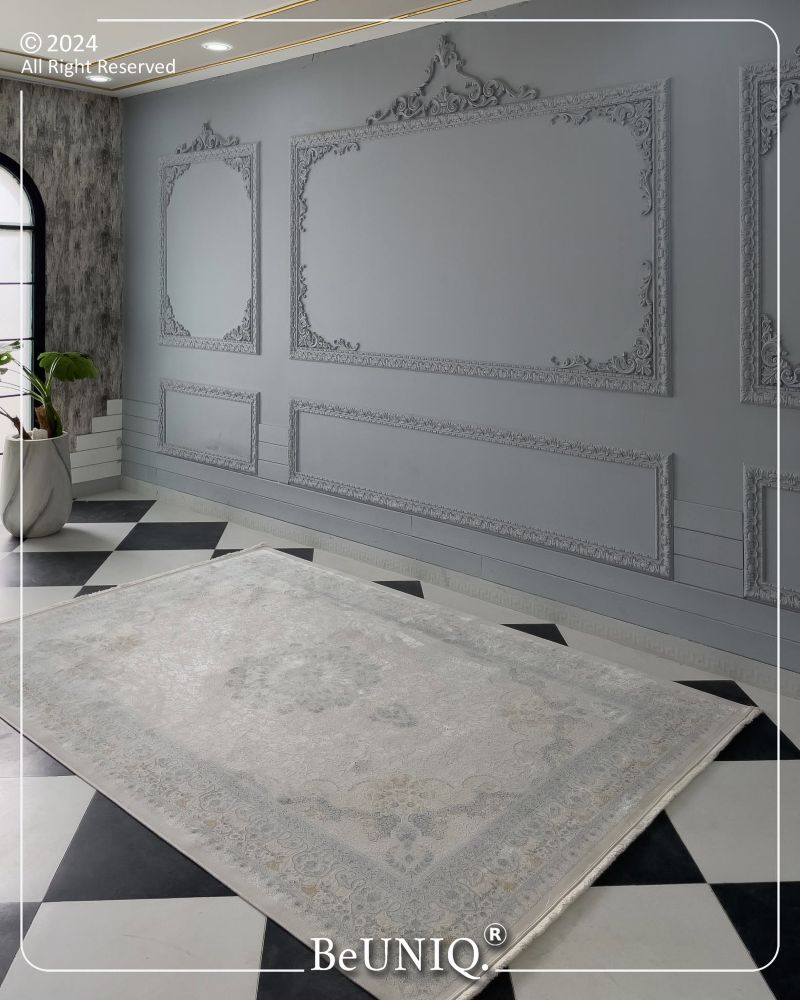 Decorative rug on a checkered floor with ornate wall designs and 'BeUNIQ' branding.