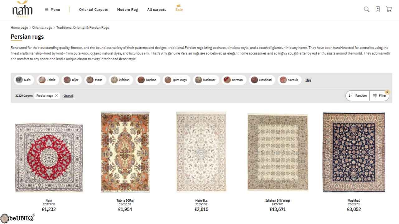 A screenshot of the Nain Trading online store's 'Persian rugs' category, showing a grid of high-quality rugs with prices and detailed filter options like Nain, Tabriz, and Isfahan.